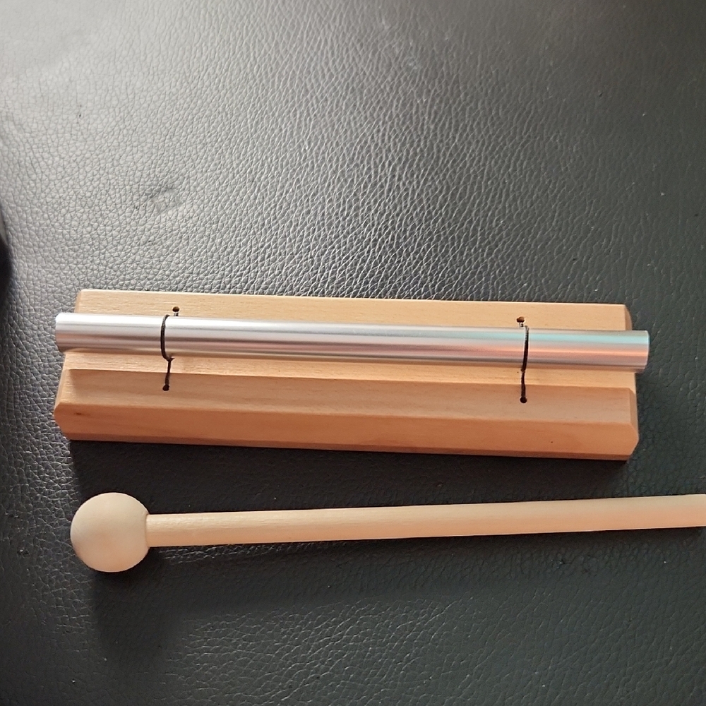 Silver and Wood Percussion Instrument